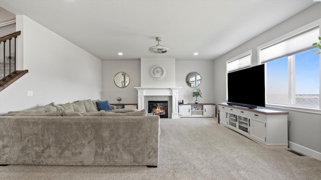 7104 W 31st Pl, Kennewick, WA 99338 - living room featuring a glass covered fireplace, carpet floors, stairway, and recessed lighting