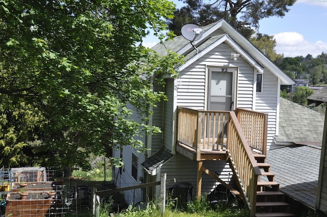 635 SE Holbrook Pl, Pullman, WA 99163 - rear view of house featuring stairway, a deck, and roof with shingles