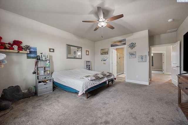 bedroom featuring a ceiling fan, baseboards, and carpet flooring