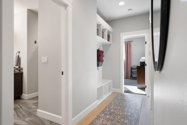 mudroom featuring baseboards