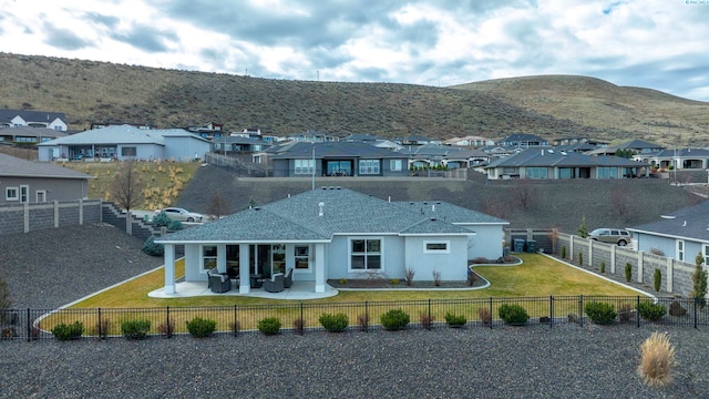 bird's eye view with a residential view and a mountain view