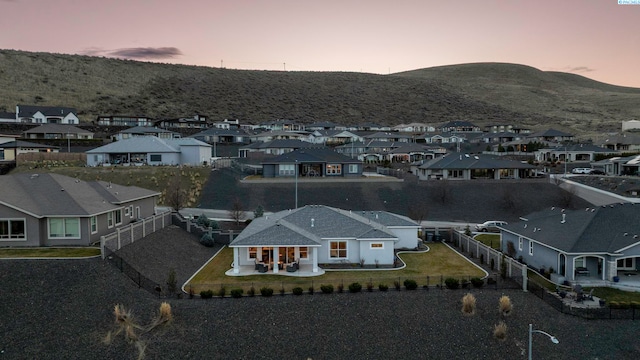 aerial view at dusk with a residential view and a mountain view