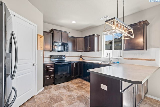 720 SW Wheat Ridge Dr, Pullman, WA 99163 - kitchen with black appliances, a sink, backsplash, and dark brown cabinets