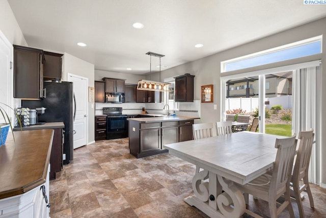 720 SW Wheat Ridge Dr, Pullman, WA 99163 - kitchen featuring black appliances, dark brown cabinets, recessed lighting, decorative light fixtures, and a sink
