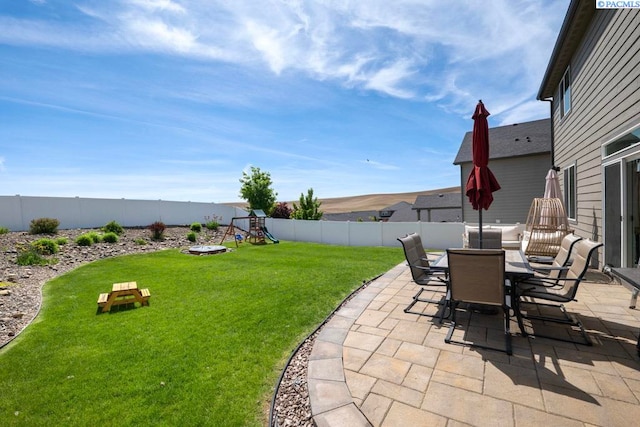720 SW Wheat Ridge Dr, Pullman, WA 99163 - view of patio with a playground and outdoor dining area
