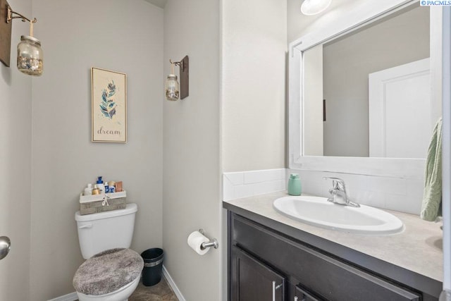 720 SW Wheat Ridge Dr, Pullman, WA 99163 - half bath with vanity, toilet, and baseboards