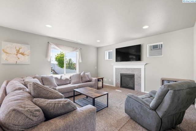 720 SW Wheat Ridge Dr, Pullman, WA 99163 - living room with carpet flooring, recessed lighting, and a glass covered fireplace