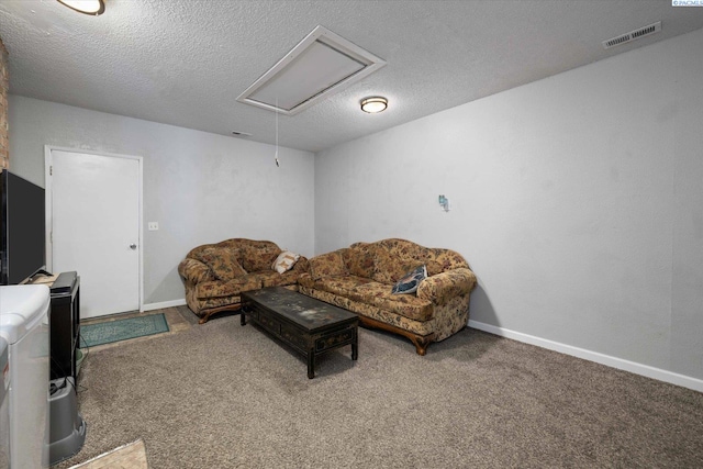 324 S Zinser St, Kennewick, WA 99336 - carpeted living area featuring attic access and a textured ceiling