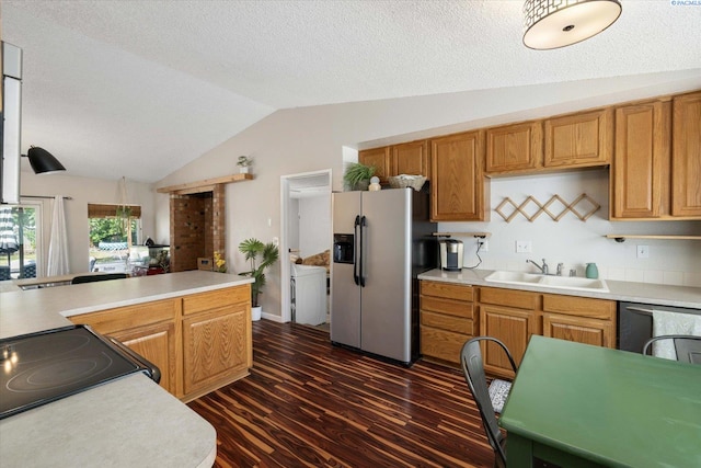 324 S Zinser St, Kennewick, WA 99336 - kitchen with refrigerator with ice dispenser, vaulted ceiling, light countertops, black range with electric stovetop, and dark wood-style flooring