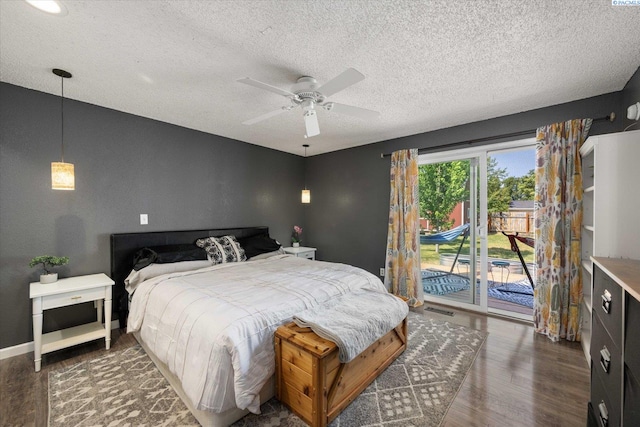 324 S Zinser St, Kennewick, WA 99336 - bedroom featuring access to outside, a textured ceiling, wood finished floors, and ceiling fan