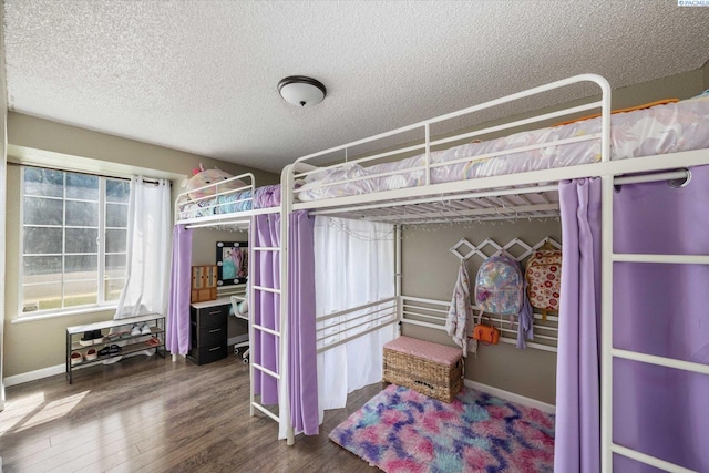 324 S Zinser St, Kennewick, WA 99336 - bedroom with a textured ceiling and wood finished floors