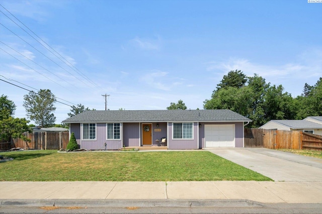 324 S Zinser St, Kennewick, WA 99336 - single story home with an attached garage, concrete driveway, and covered porch