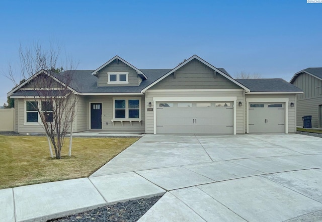 craftsman-style house with a garage and a front yard