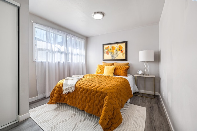 1301 Wright Ave, Richland, WA 99354 - bedroom with baseboards and wood finished floors
