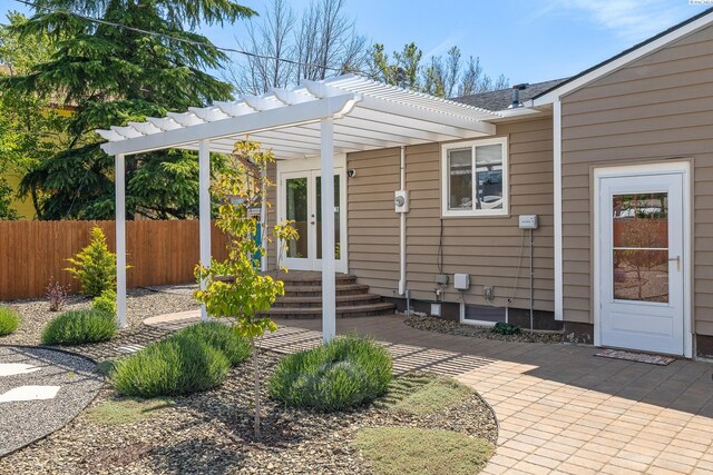 78 Whitten, Richland, WA 99354 - view of exterior entry with fence, a pergola, french doors, and a patio area