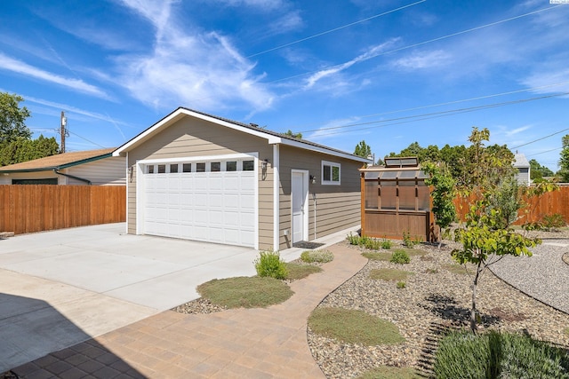 78 Whitten, Richland, WA 99354 - garage featuring fence and concrete driveway