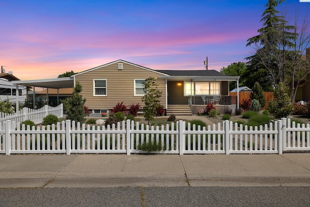 78 Whitten, Richland, WA 99354 - view of front facade featuring a porch, a fenced front yard, and a carport