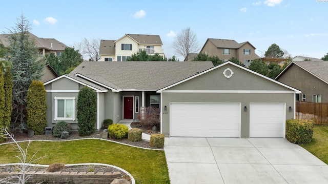 view of front of home with a garage and a front lawn