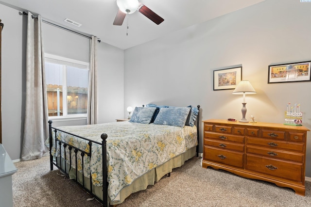 bedroom featuring ceiling fan and light carpet