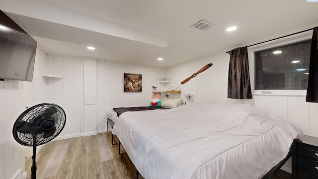 bedroom with hardwood / wood-style floors