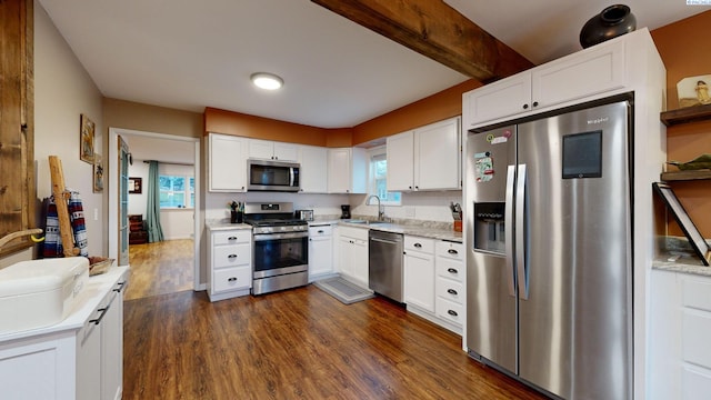 kitchen featuring dark wood-type flooring, appliances with stainless steel finishes, sink, and white cabinets