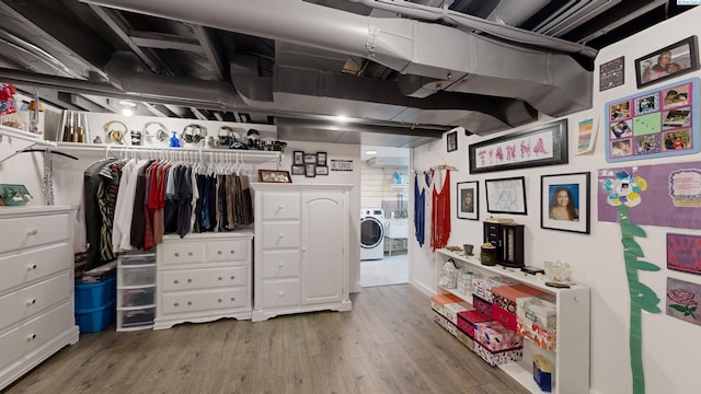 interior space featuring washer / dryer and wood-type flooring