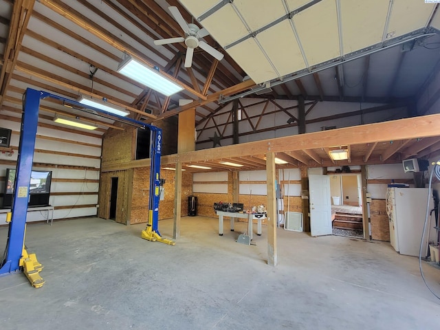 garage featuring white fridge