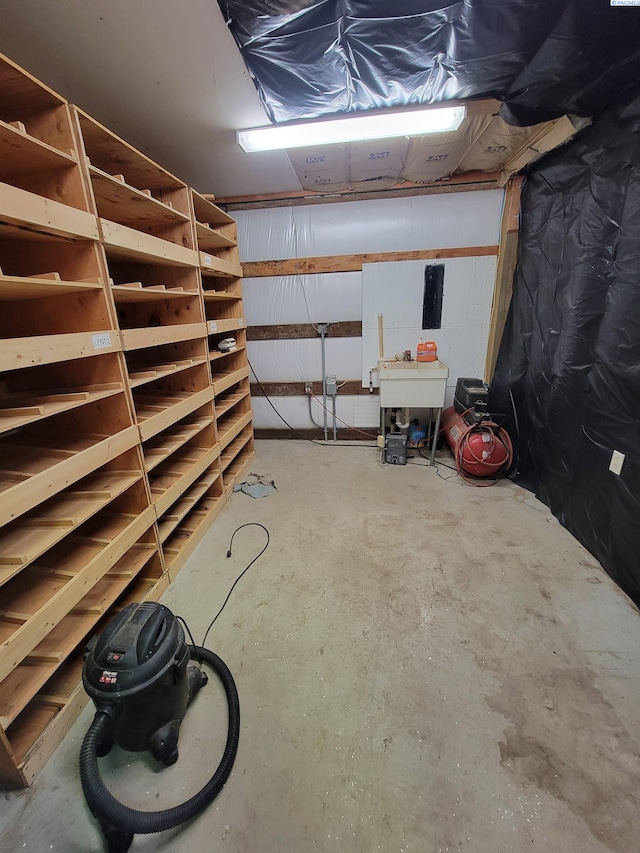 garage with sink and electric panel