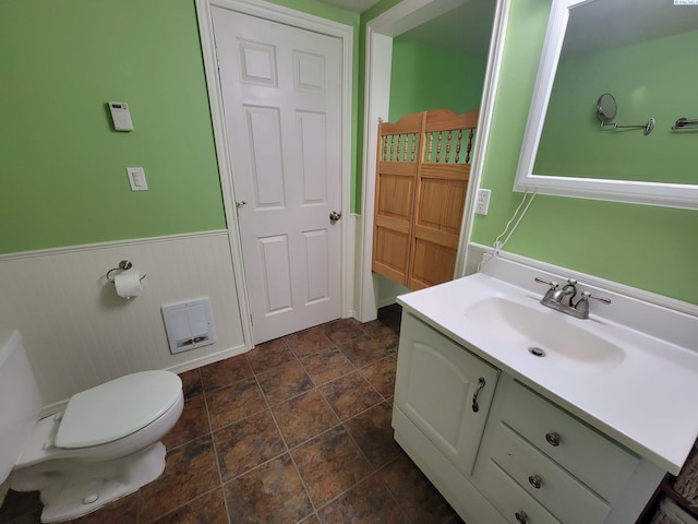 bathroom with vanity and toilet