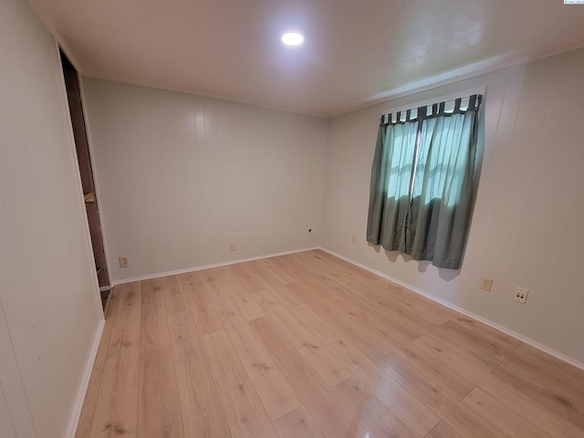 spare room featuring light wood-type flooring