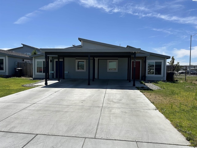 2502 Blaine St, Pasco, WA 99301 - ranch-style home with concrete driveway and an attached carport