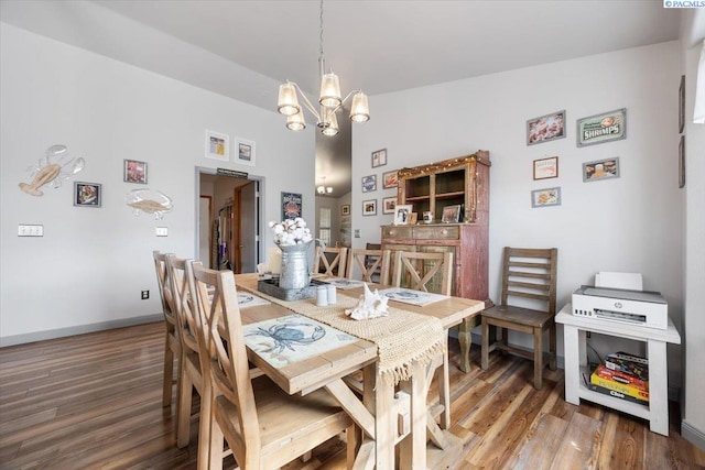 4210 Desert Plateau, Pasco, WA 99301 - dining space with a chandelier, wood finished floors, and baseboards