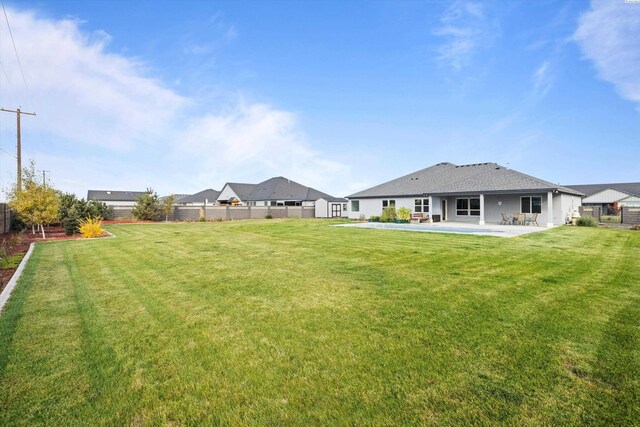 view of yard with a patio and a fenced backyard