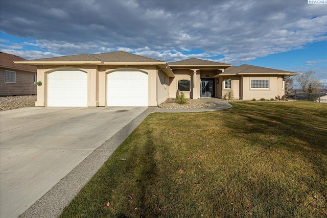 view of front of property with stucco siding, an attached garage, concrete driveway, and a front lawn