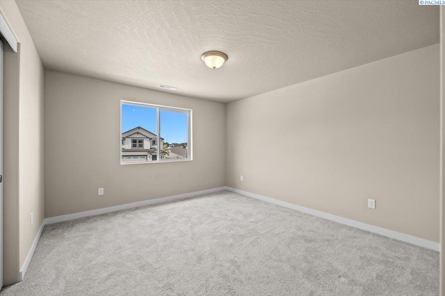 200 Ladera St, Prosser, WA 99350 - carpeted spare room featuring a textured ceiling and baseboards