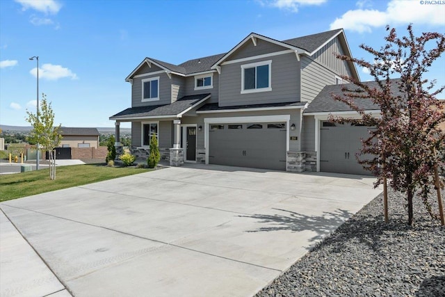 200 Ladera St, Prosser, WA 99350 - craftsman inspired home featuring driveway, a garage, board and batten siding, stone siding, and a shingled roof