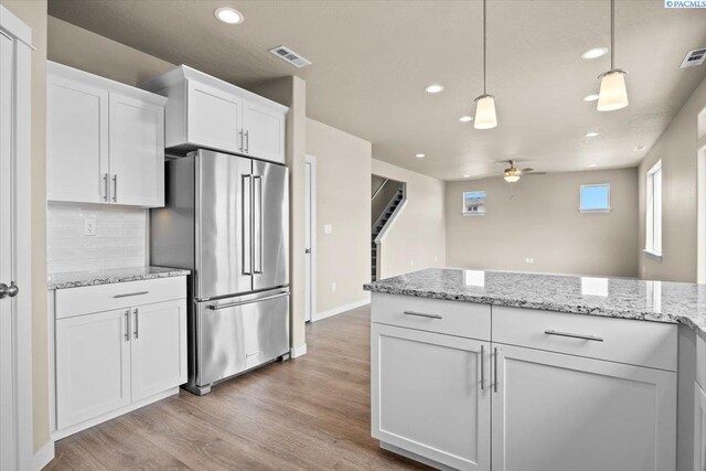 200 Ladera St, Prosser, WA 99350 - kitchen featuring high quality fridge, ceiling fan, recessed lighting, light wood-style flooring, and white cabinetry