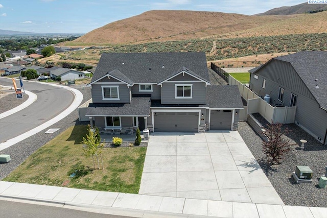 200 Ladera St, Prosser, WA 99350 - craftsman-style house featuring a mountain view, covered porch, concrete driveway, and a garage