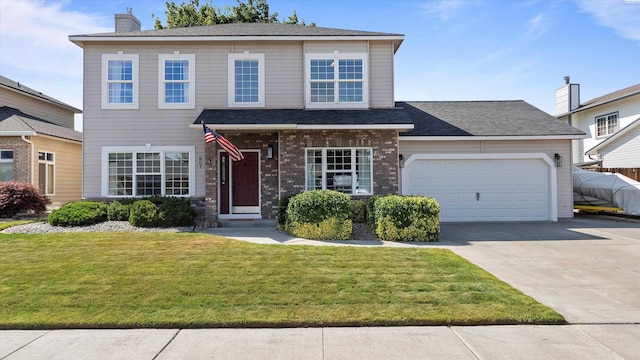 607 N Quebec St, Kennewick, WA 99336 - traditional-style house featuring concrete driveway, an attached garage, a front yard, a chimney, and roof with shingles