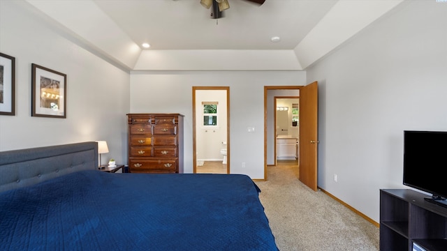 607 N Quebec St, Kennewick, WA 99336 - bedroom with ensuite bathroom, light colored carpet, a raised ceiling, and a ceiling fan