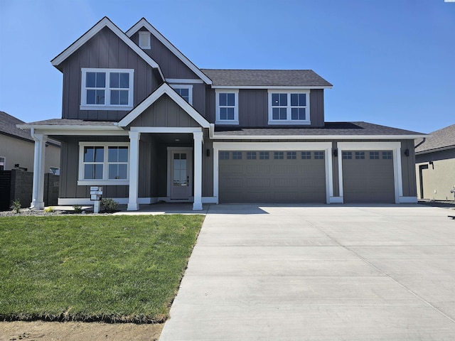 6008 Rd 122, Pasco, WA 99301 - craftsman inspired home featuring board and batten siding, a garage, concrete driveway, roof with shingles, and a front lawn