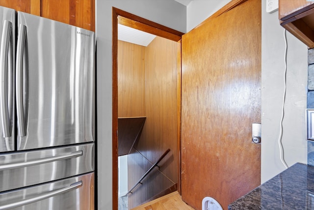 405 W 7th Ave, Ritzville, WA 99169 - room details with stainless steel refrigerator, dark stone counters, and light hardwood / wood-style flooring