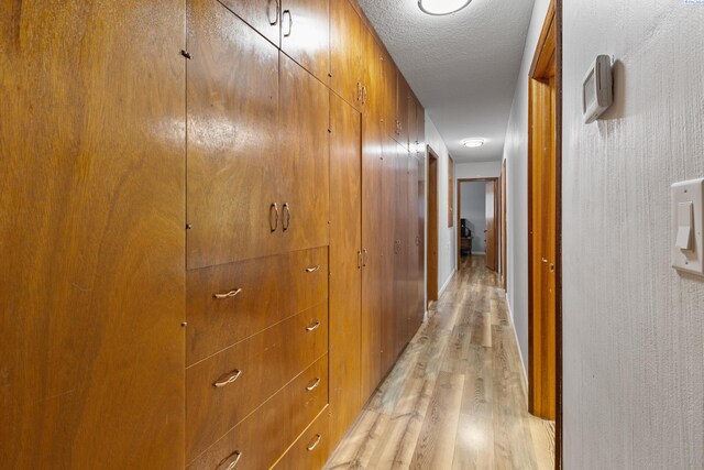 405 W 7th Ave, Ritzville, WA 99169 - hall featuring a textured ceiling and light wood-type flooring