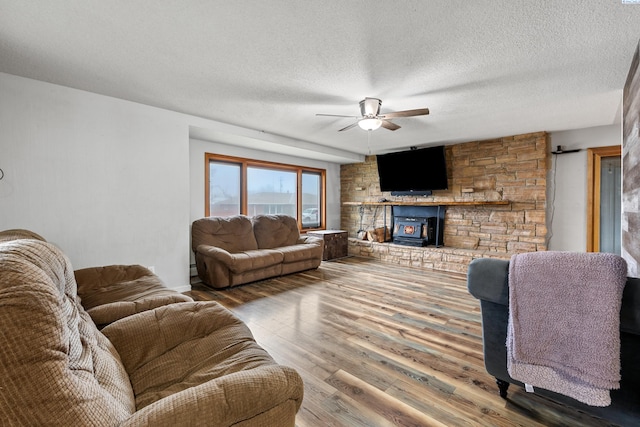 405 W 7th Ave, Ritzville, WA 99169 - living room featuring hardwood / wood-style flooring, ceiling fan, and a textured ceiling