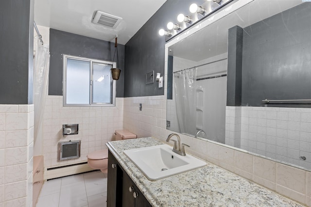 405 W 7th Ave, Ritzville, WA 99169 - bathroom with tile patterned flooring, tile walls, vanity, a baseboard radiator, and toilet