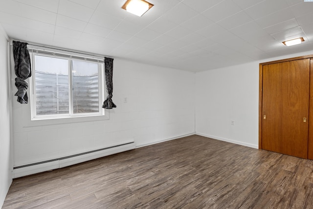 405 W 7th Ave, Ritzville, WA 99169 - empty room featuring wood-type flooring and a baseboard heating unit