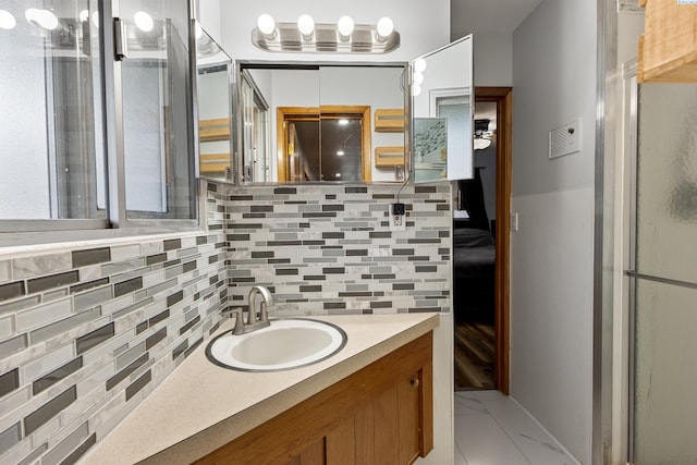 405 W 7th Ave, Ritzville, WA 99169 - bathroom featuring tasteful backsplash, vanity, and an enclosed shower