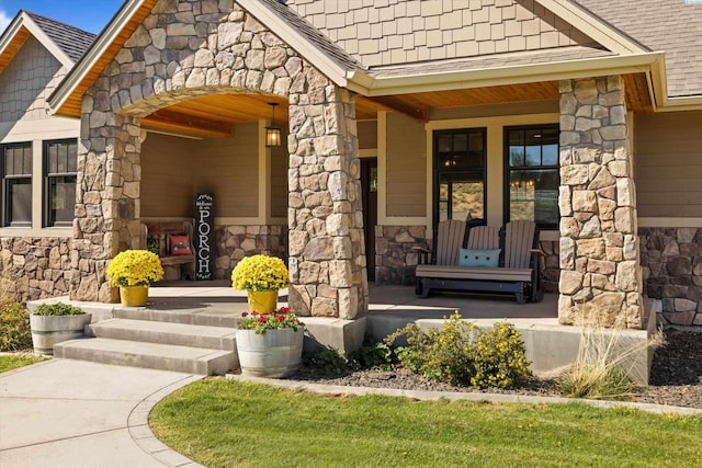 entrance to property featuring covered porch