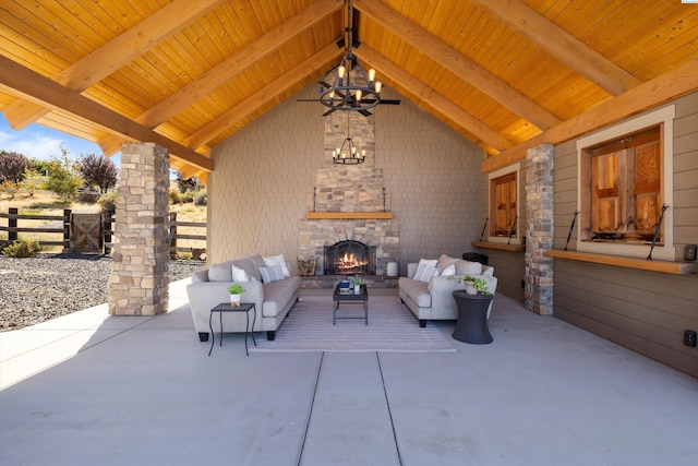 view of patio / terrace featuring ceiling fan and an outdoor living space with a fireplace