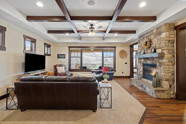 living room featuring coffered ceiling, a fireplace, dark hardwood / wood-style flooring, and beam ceiling